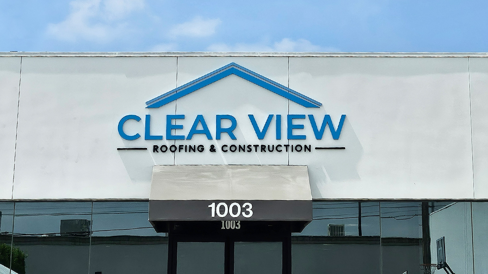 clear view roofing and construction foam letters on facade