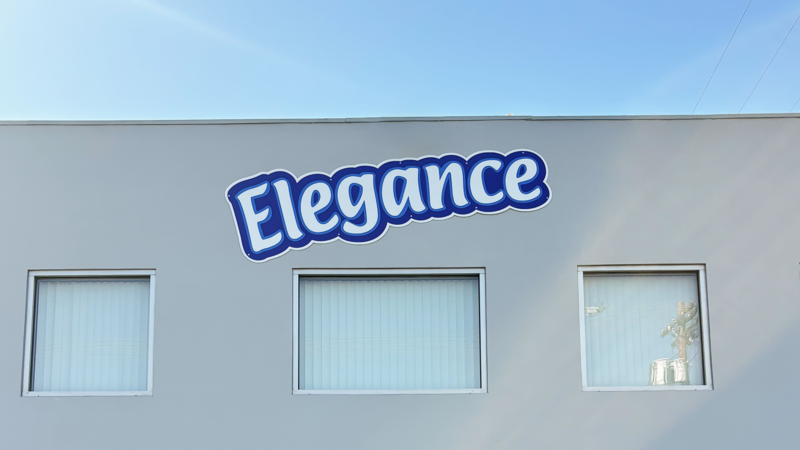 elegance foods dibond logo sign on facade