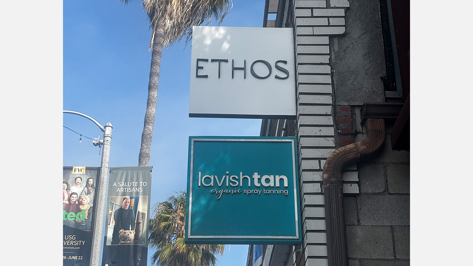 ethos hair studio aluminum blade sign on bracket