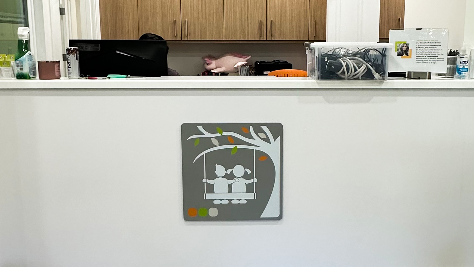 forever smiles pediatric acrylic logo on desk