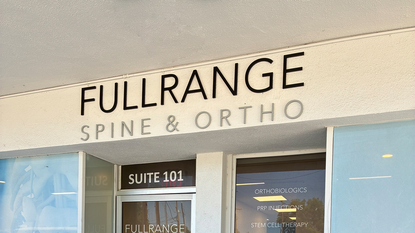 fullrange spine ortho acrylic sign on storefront