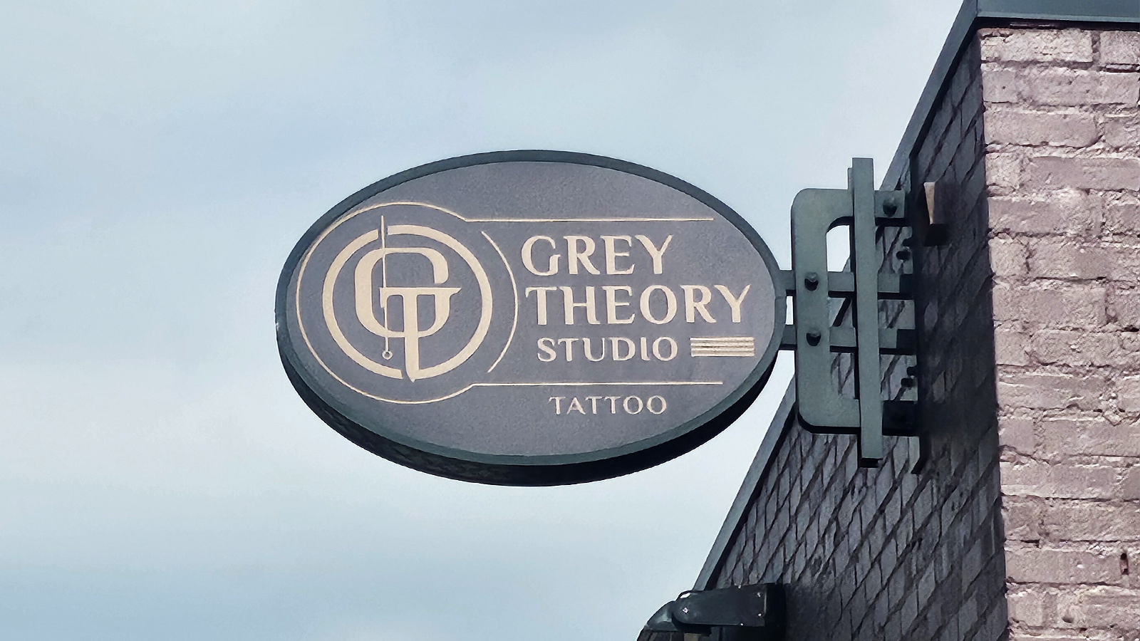 grey theory studio lexan blade sign on bracket
