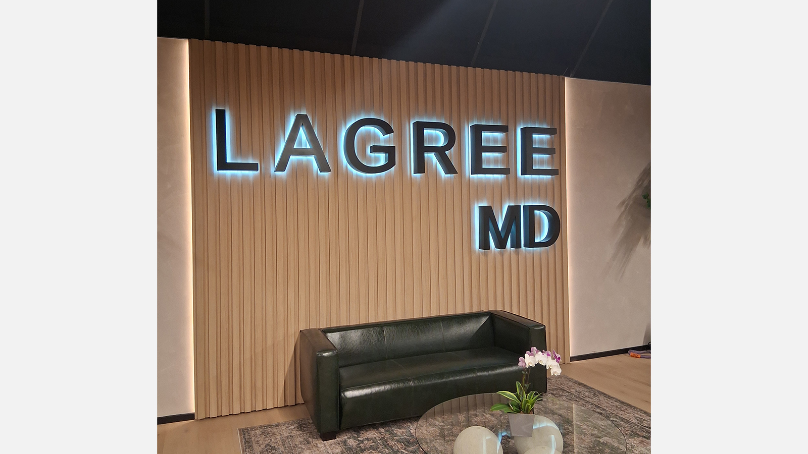 lagree md backlit acrylic letters on slat wall