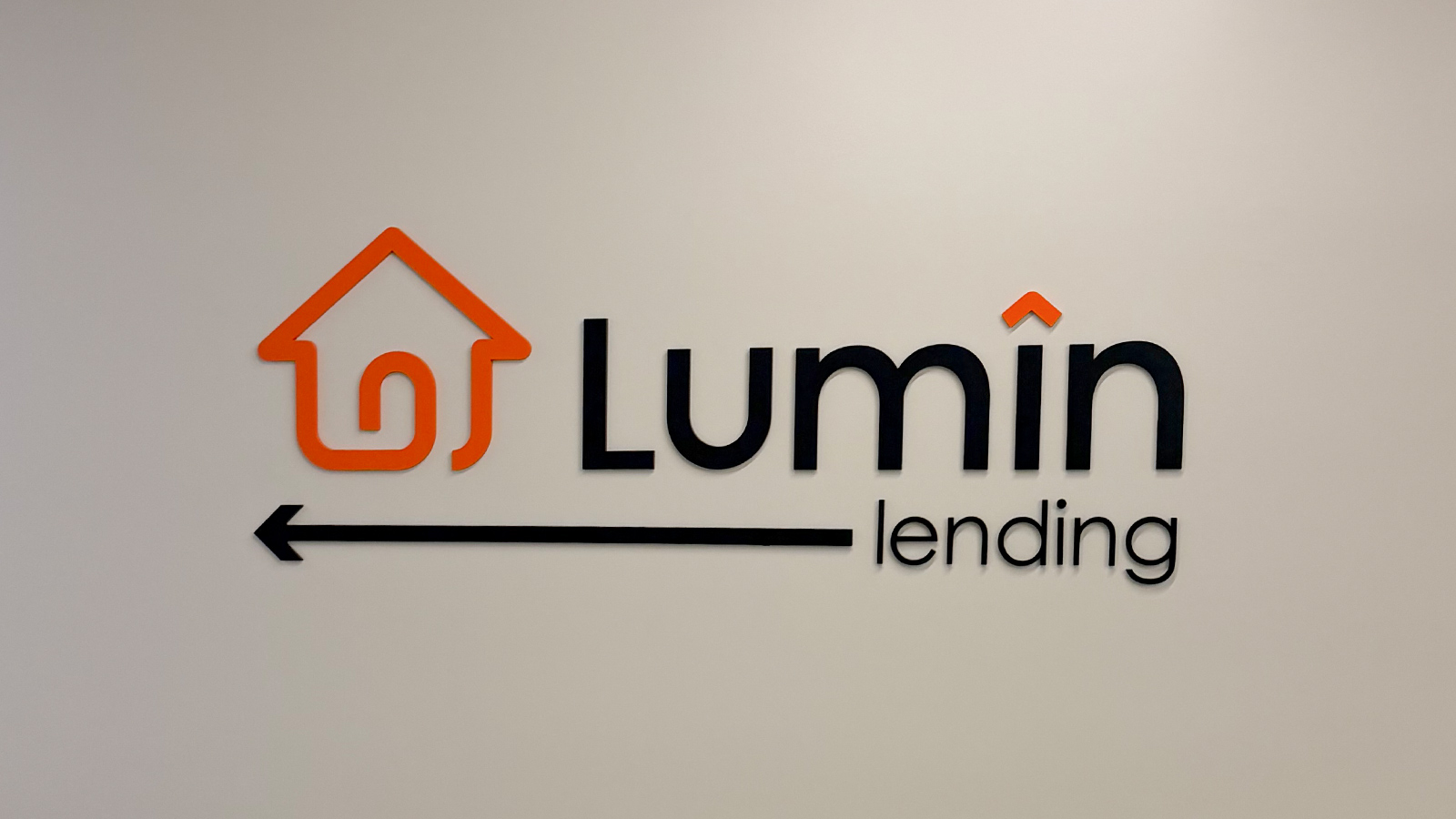 lumin lending acrylic logo sign on wall