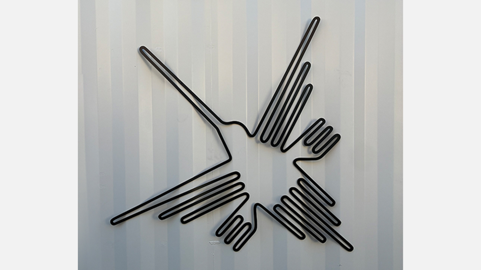 nazca fusion aluminum hummingbird cutout on facade