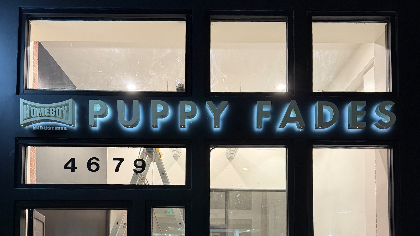 puppy fades backlit channel letters on the storefront