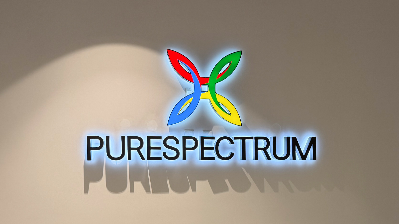 purespectrum backlit reverse channel letters on wall
