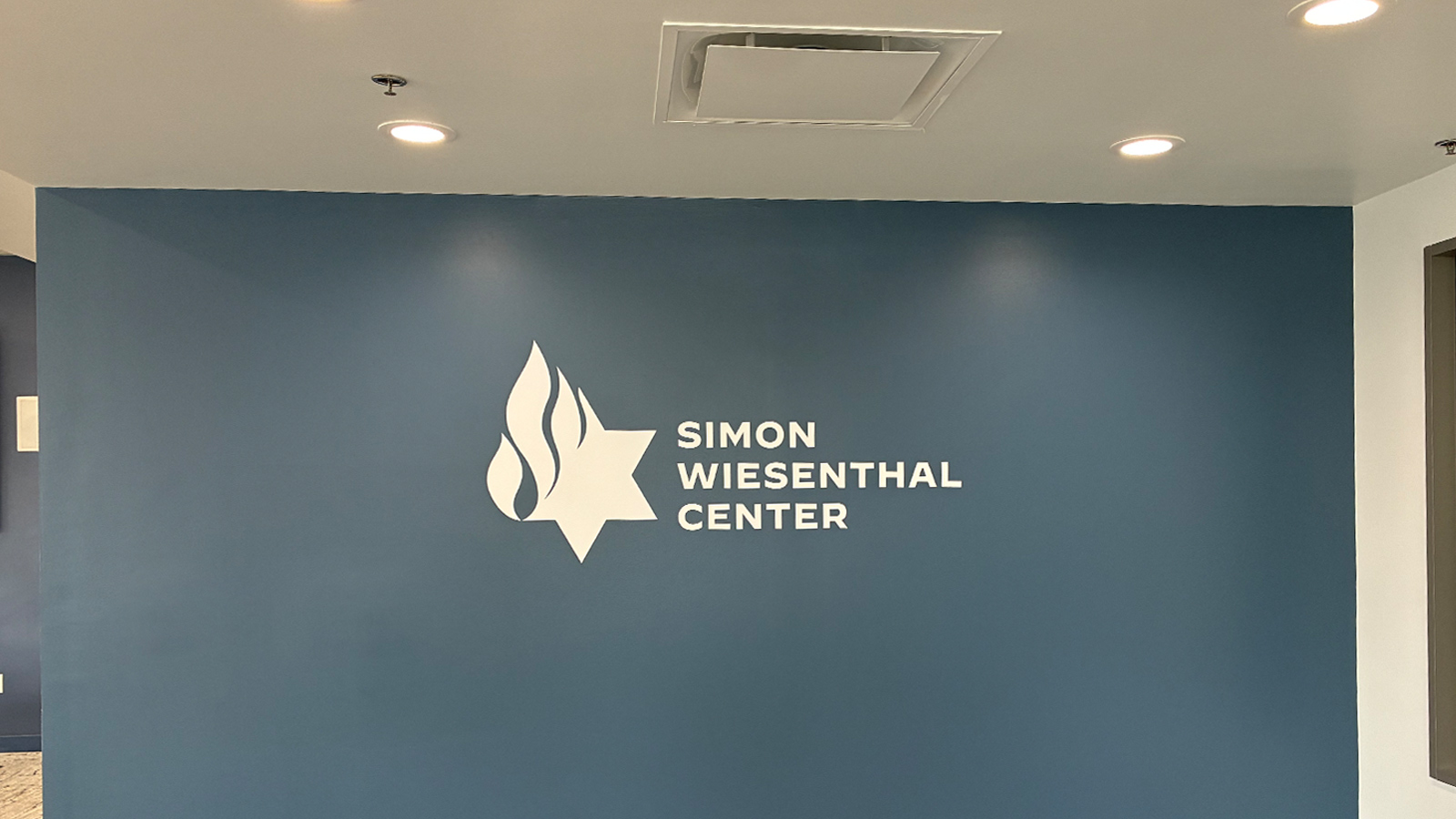 simon wiesenthal center wall vinyl on blue wall