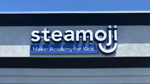 steamoji illuminated channel letters on storefront